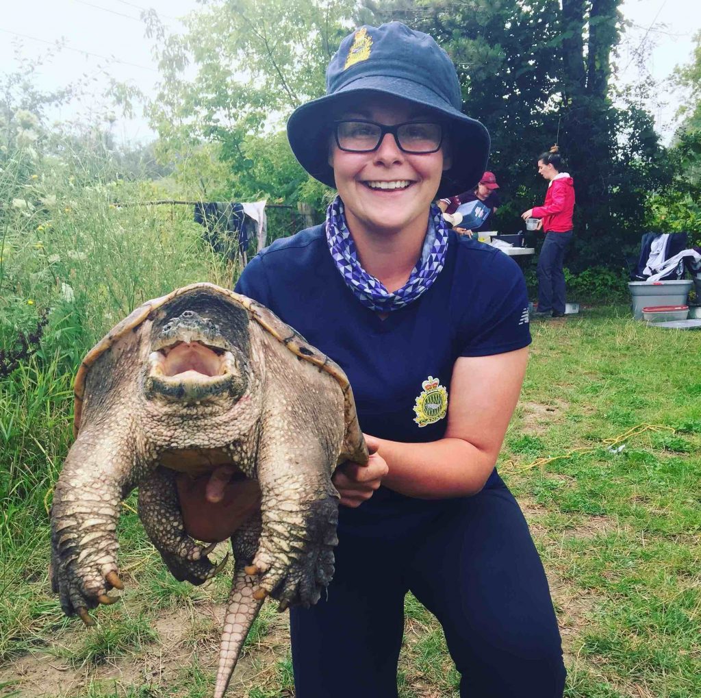 woman holding a turtle