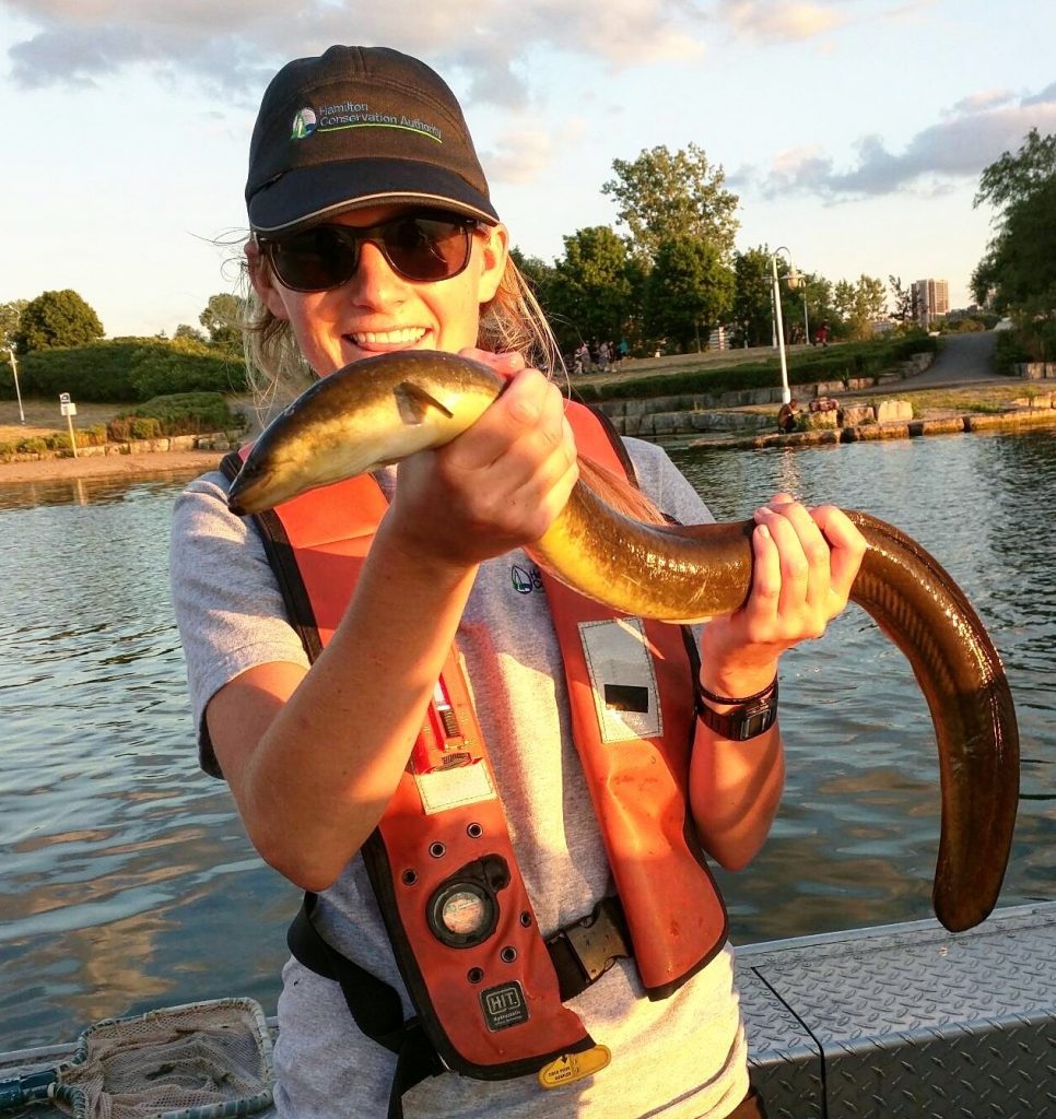 woman holding an eel