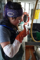 woman sampling fish