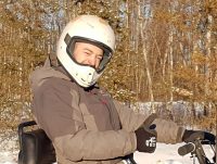 man wearing a helmet riding an offroad vehicle