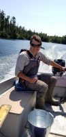 man driving a boat