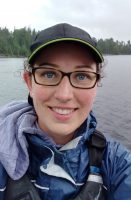 woman in a boat smiling