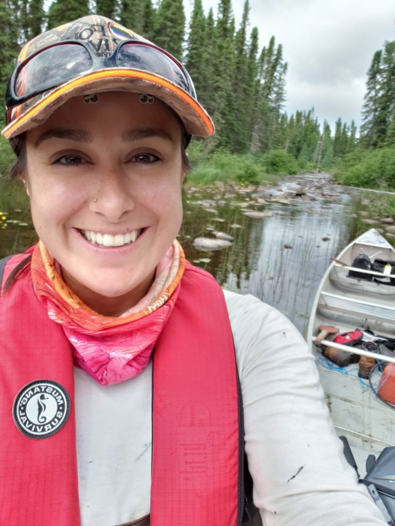 woman in a canoe smiling