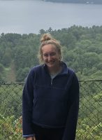 Woman posing in front of scenery